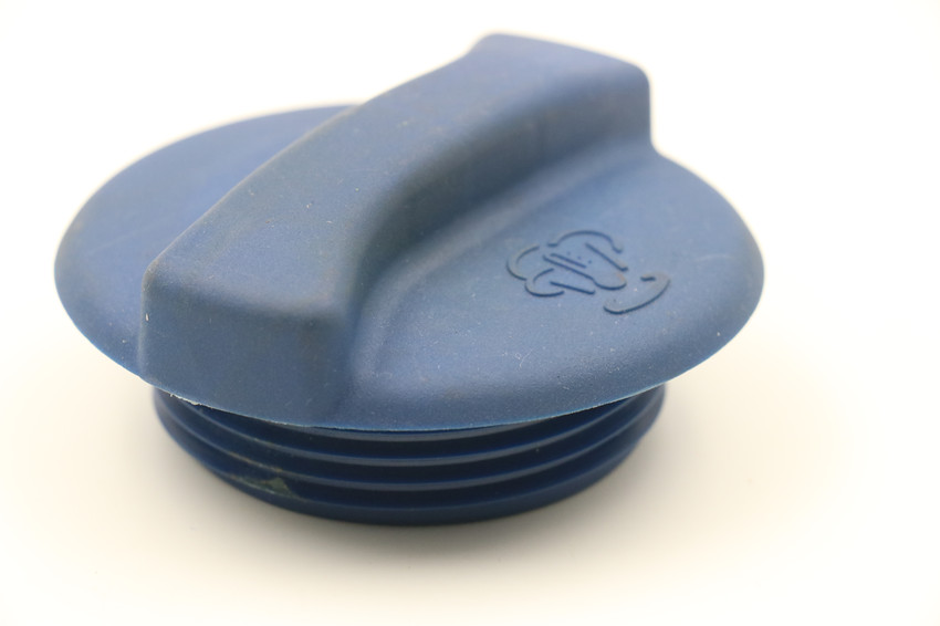Image featuring a high-quality coolant expansion tank cap, highlighting the precision and expertise in mold making