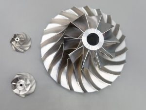 High-precision machined aluminum turbine component manufactured by HS Molds, showcasing our capabilities in complex CNC machining
